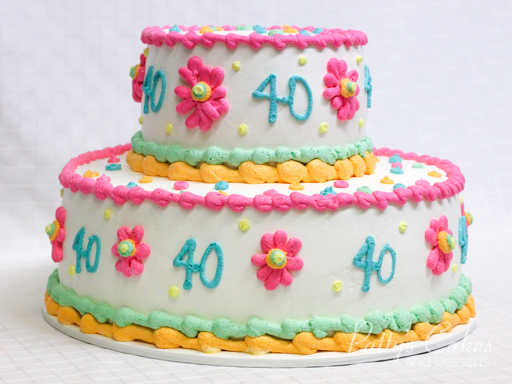 40th-birthday-cake-2-tier-pink-white-green-yellow